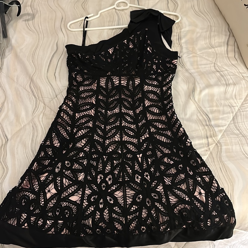 Black crochet lace with pink underlining.